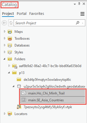 In the Catalog pane, two layers are dragged from the recovered geodatabase to the map view