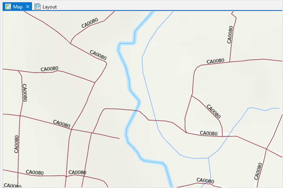 In the map view, the labels for a line feature layer are displayed in ArcGIS Pro. The lines in the map represent roads.