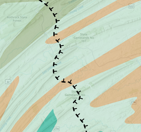 The dashed line symbol with tick marks representing the fault and dip direction on the map.